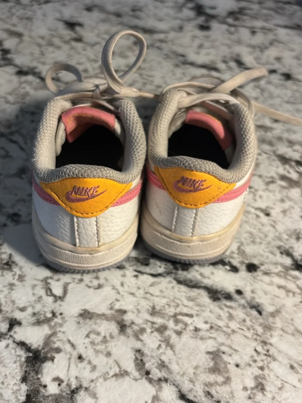 Nike Kids White Sneakers with Pink and Gold Accents